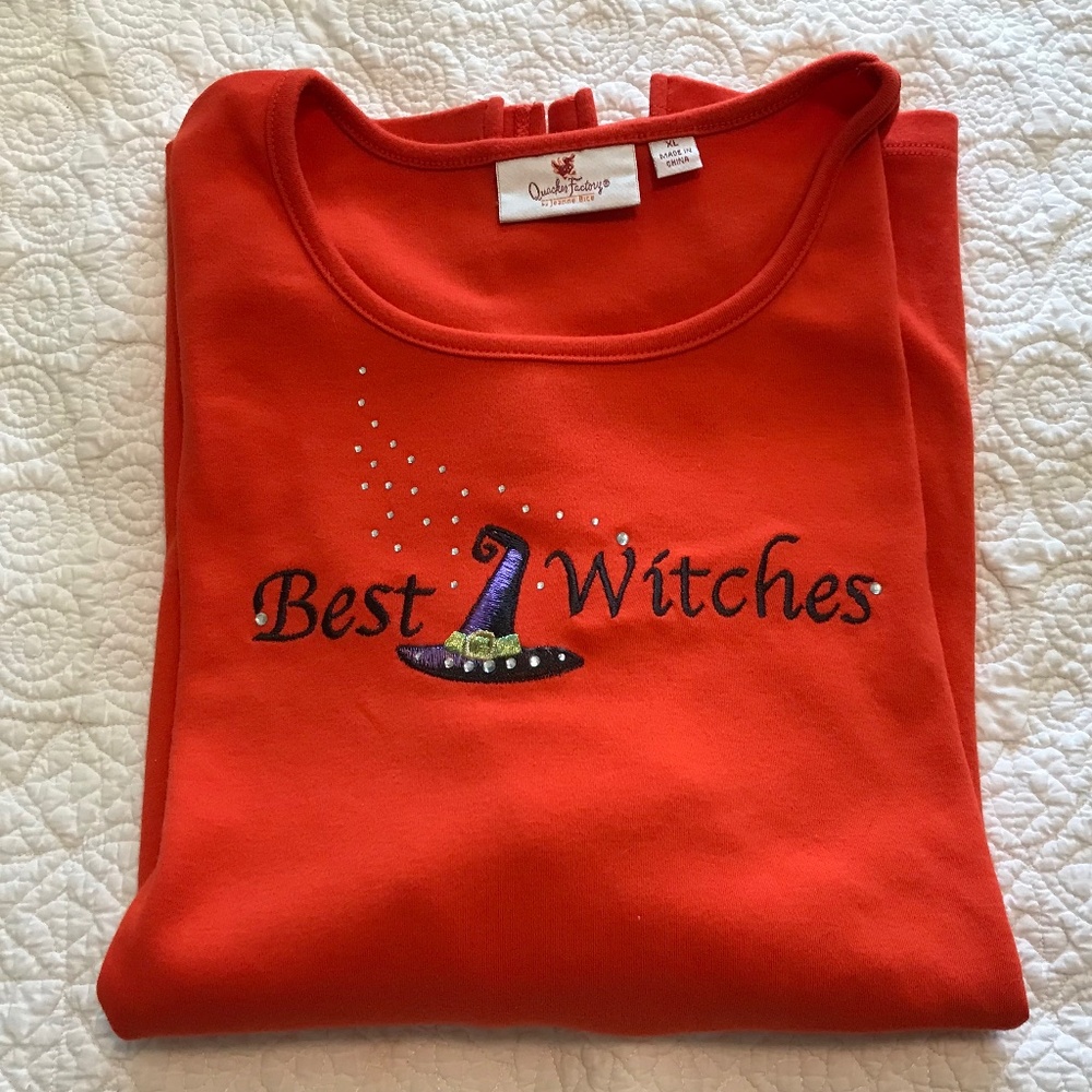 QF orange elbow-length sleeved top with embroidered “Best Witches” (XL)